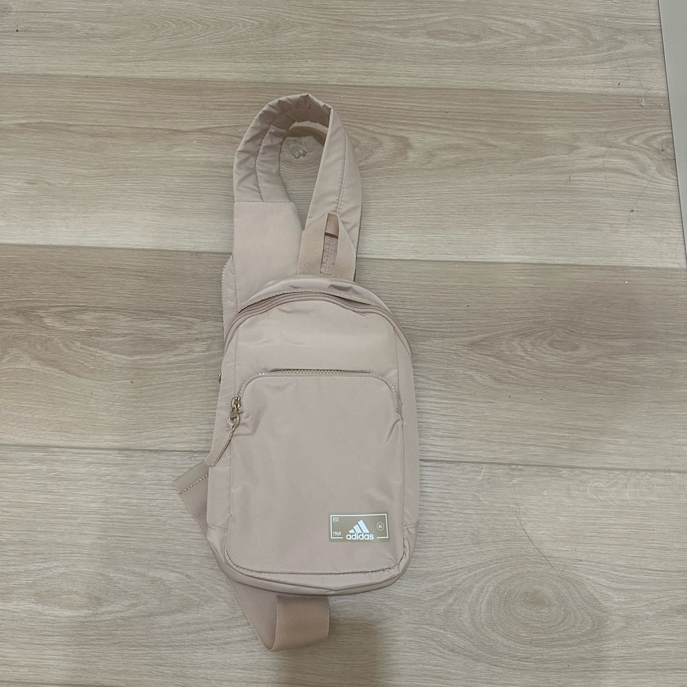 Beige crossbody backpack